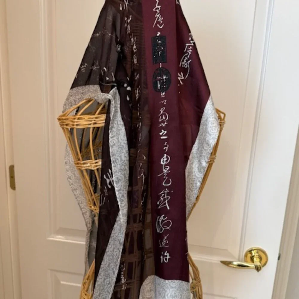 100% silk wine colored and silver oblong scarf.